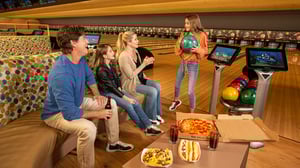 Photo of family having fun and snacks in Grand Bowling Center. at GSR