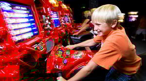 Arcade games in action with young guest.
